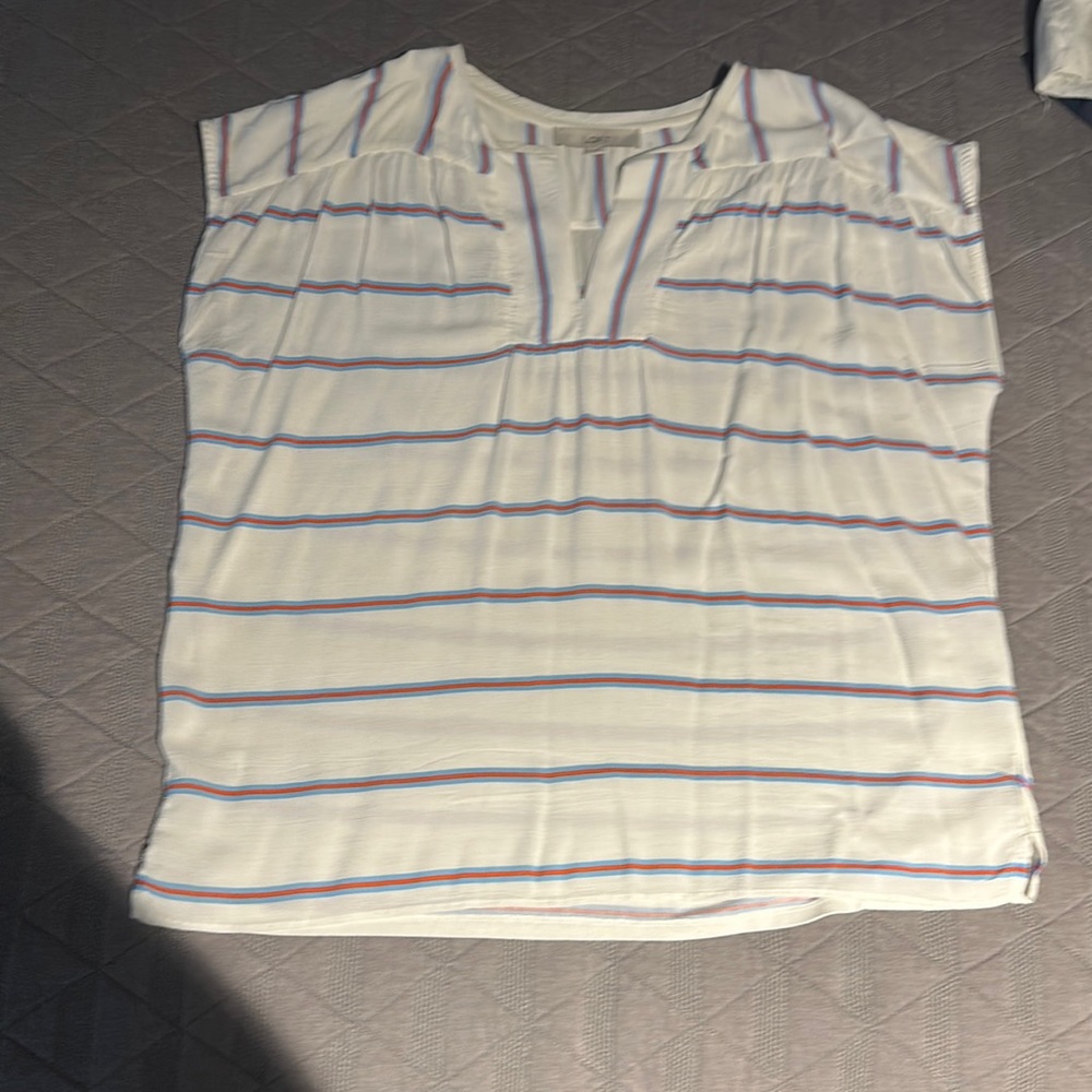 Perfect for summer with fun v detail in color. White with Red and Blue Stripes.